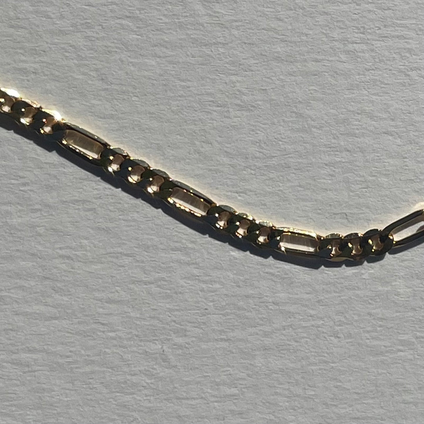 gold figaro chain