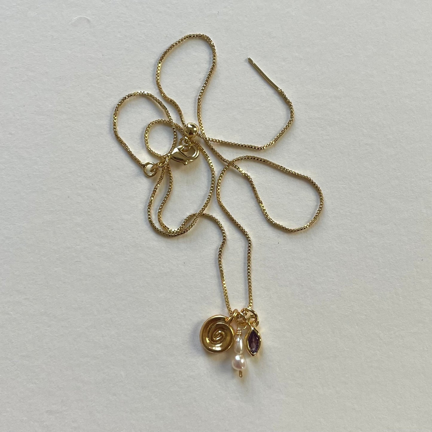 gold charms IX