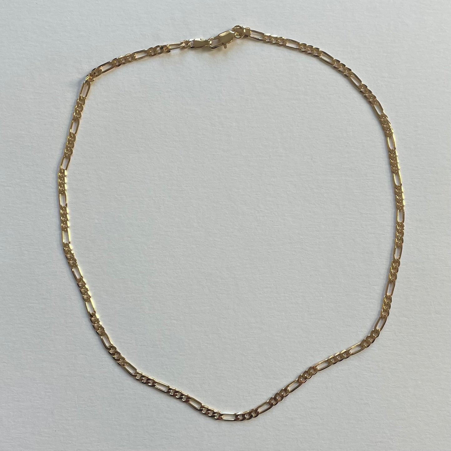 gold figaro chain