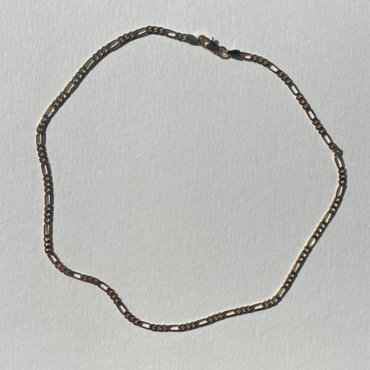 gold figaro chain