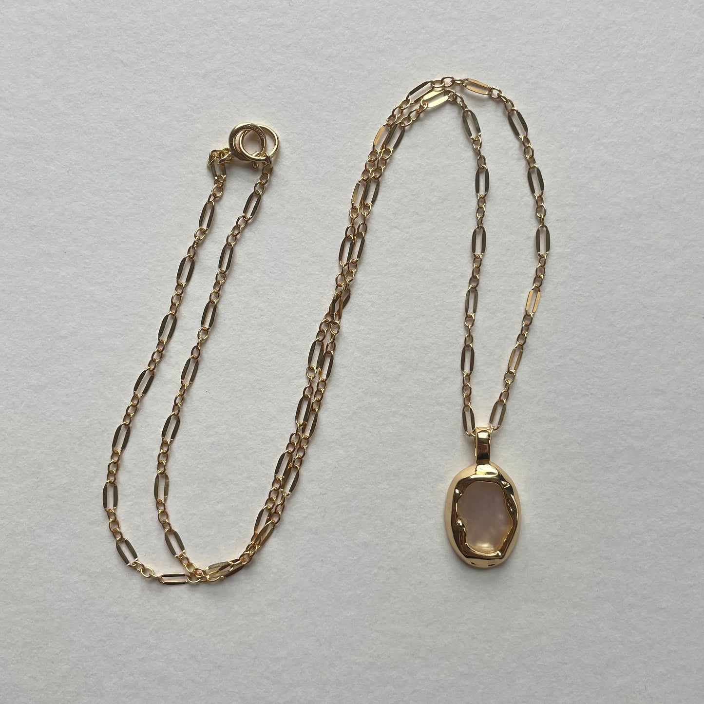 gold shell pendant