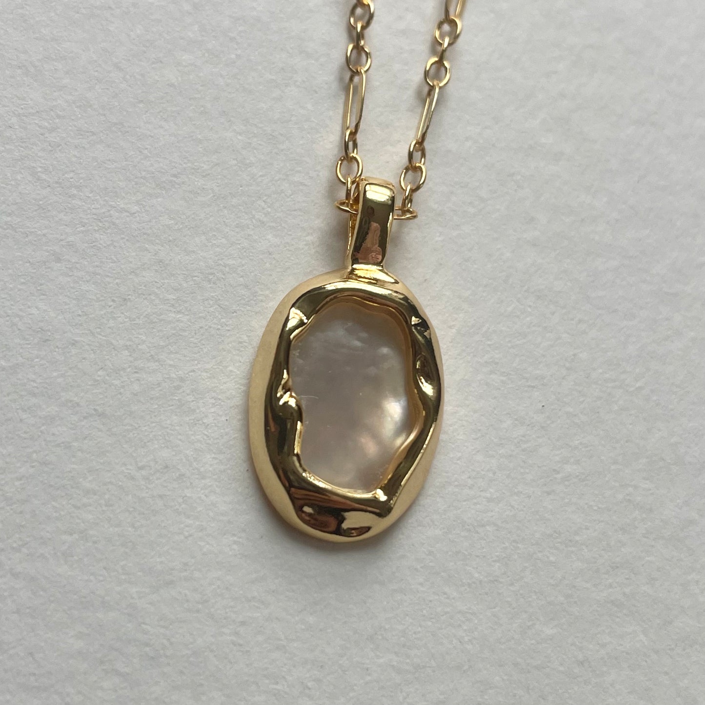 gold shell pendant